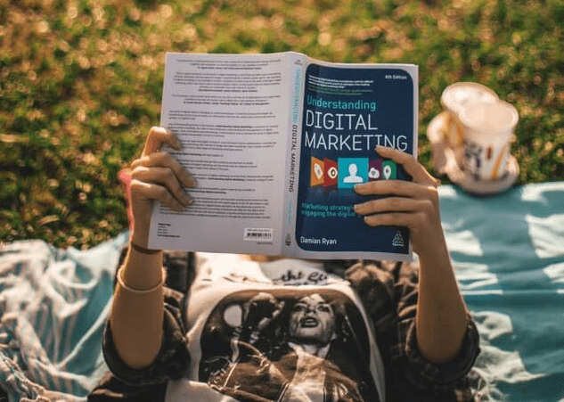 Person reading digital marketing book